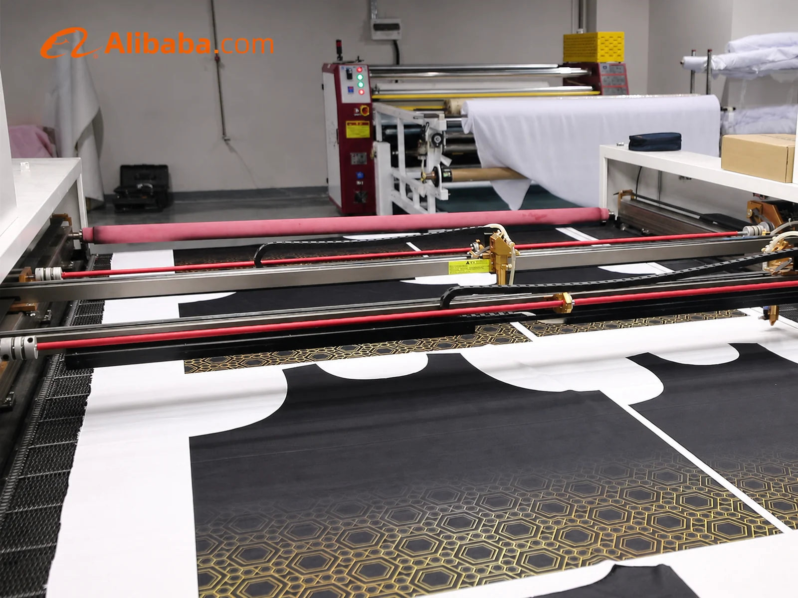 Fabric panels on a cutting table inside the HUINA factory